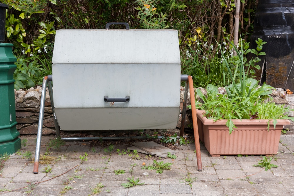 Barrel compost tumbler in garden